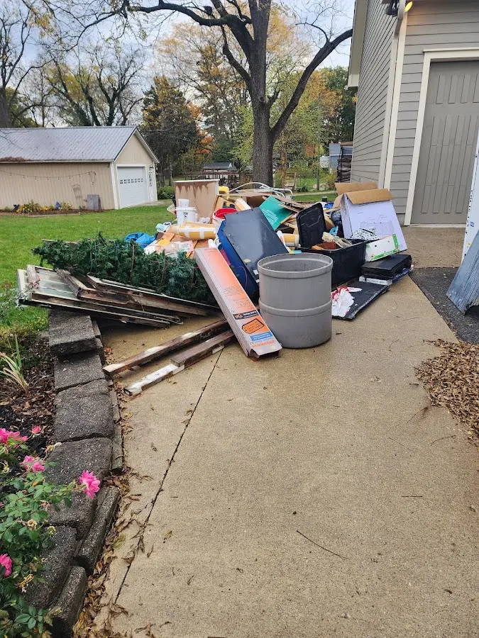 Dumpster being loaded with debris for Commercial Dumpster Rental in Berwyn